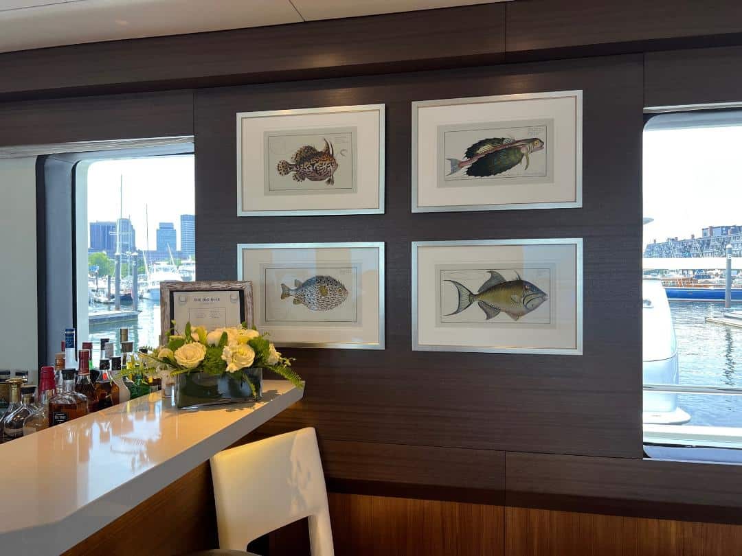 A grouping of four framed, Eleiser Bloch fish engravings, with18th century hand-coloring, hung two over two, now on board the mega yacht, named "The Big Blue."